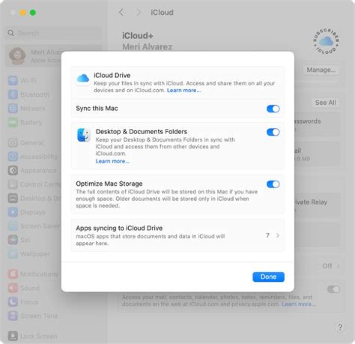 How do I pause iCloud photo download?