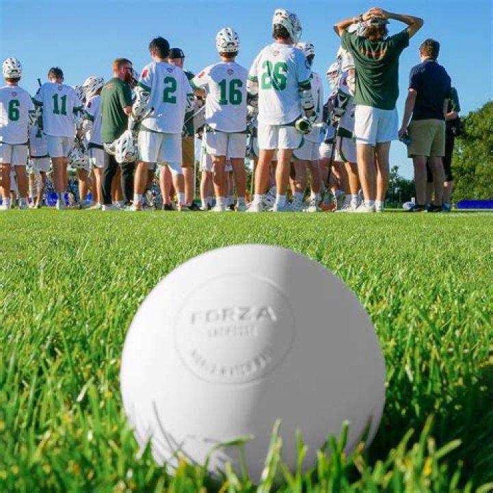 What were lacrosse balls originally made of?