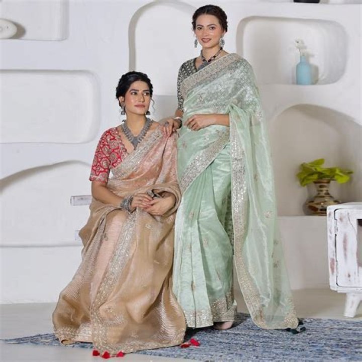 Why saree is worn below navel?
